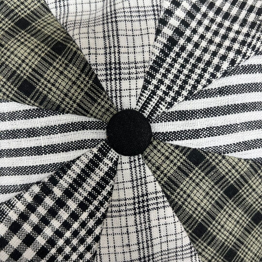 A close up of the black and white pattern on a pillow
