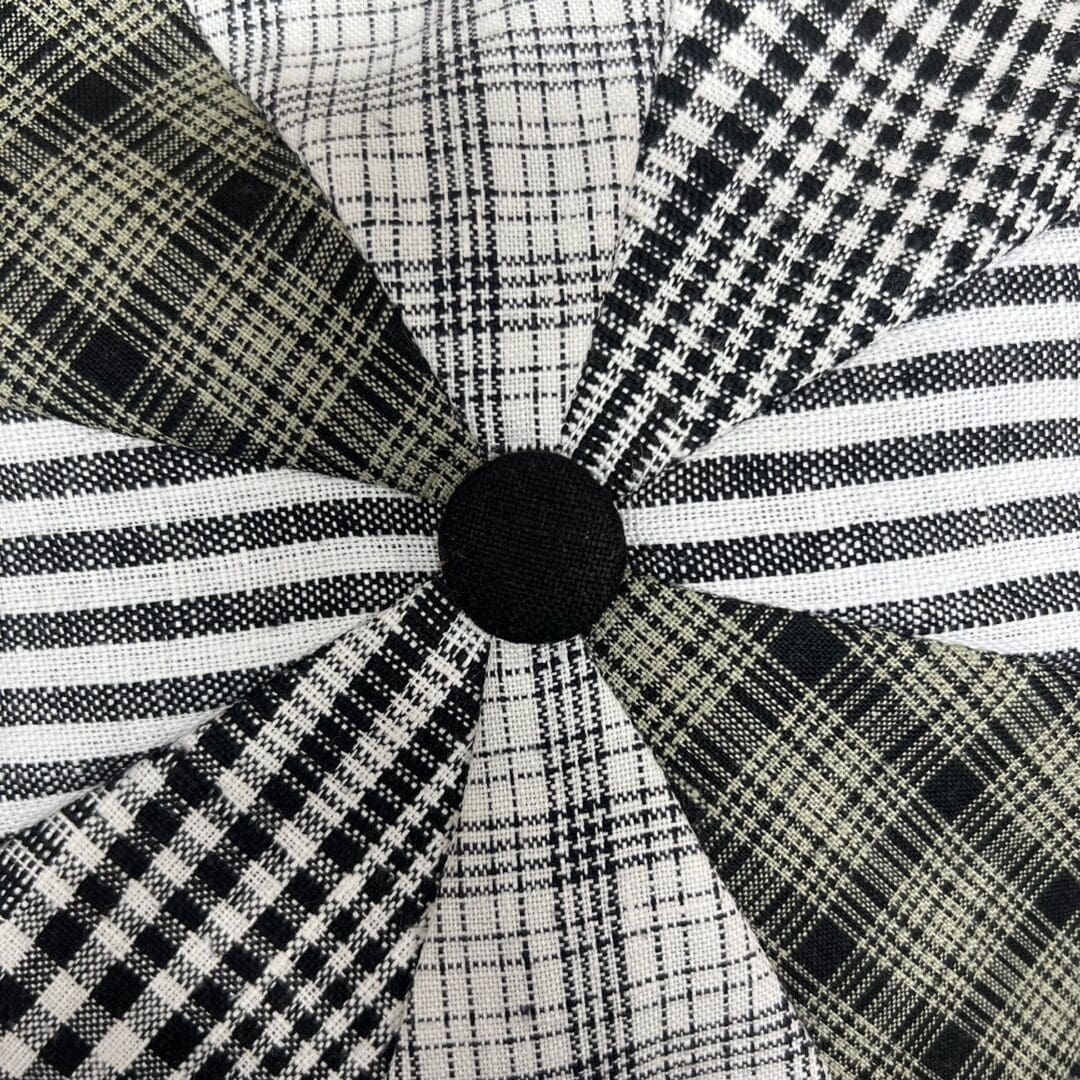 A close up of the black and white pattern on a pillow