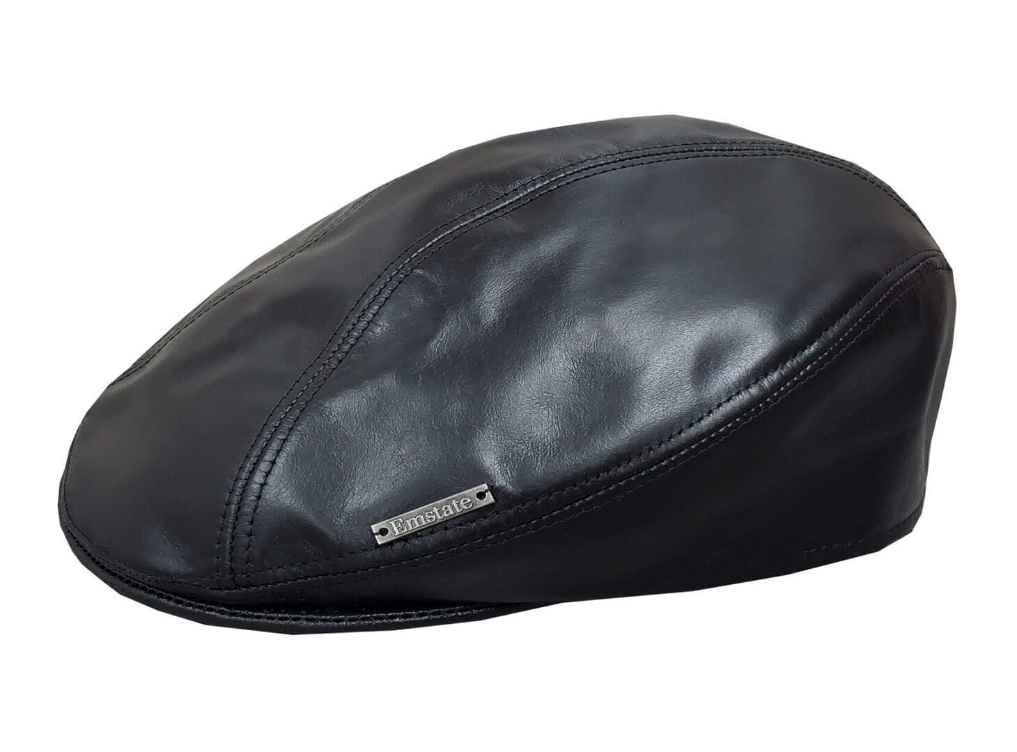A black leather hat with a metal pin.