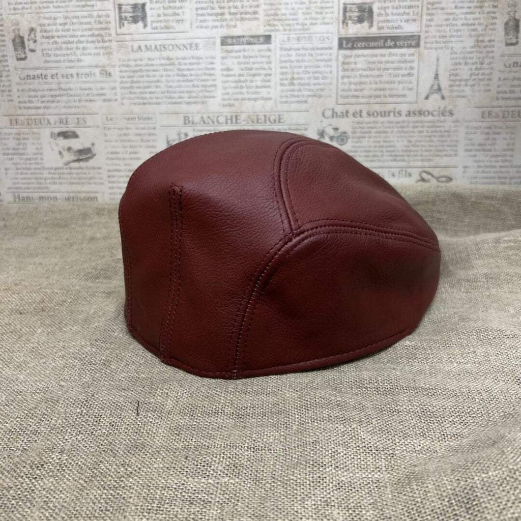 A brown hat sitting on top of the floor.