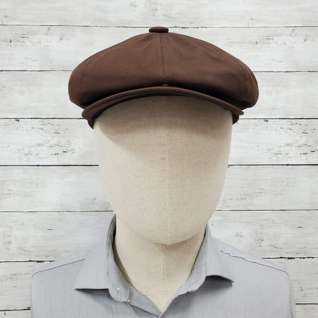 A man wearing a brown hat and shirt.