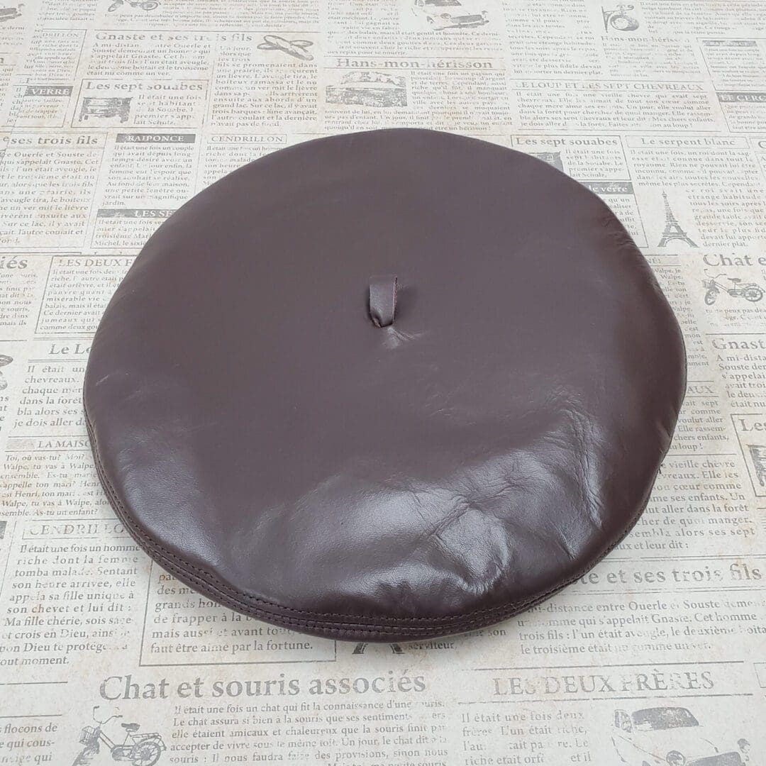 A chocolate covered cookie sitting on top of a table.