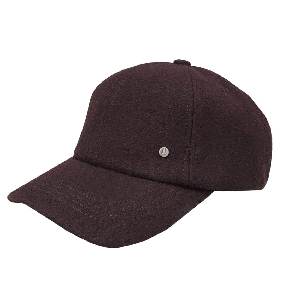 A brown hat with a white dot on it.