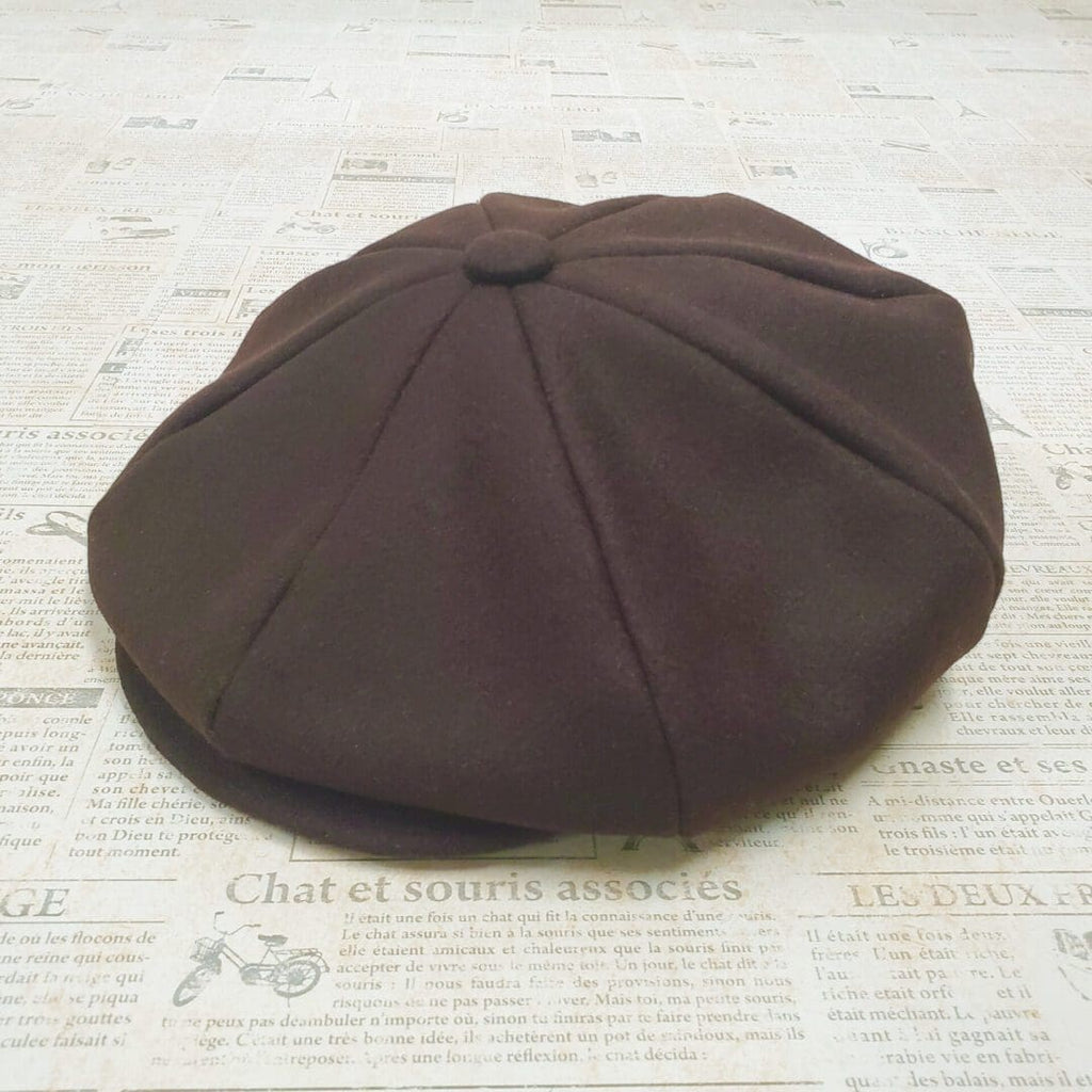 A brown hat sitting on top of a table.