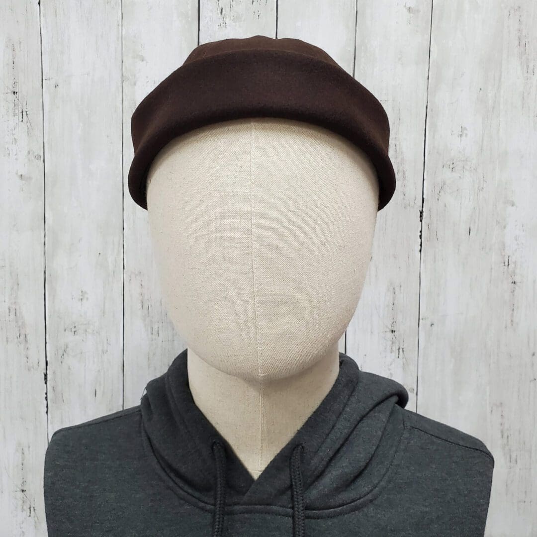 A person with a hat on and no face