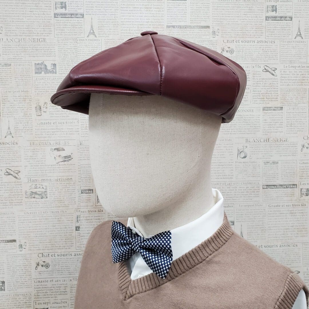 A man wearing a bow tie and a hat.