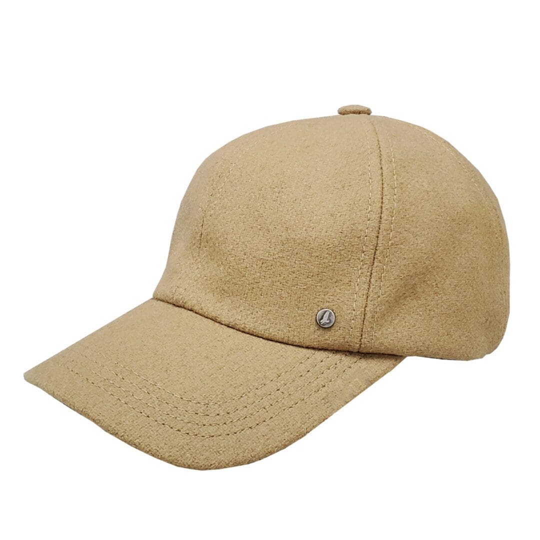 A tan hat is on the ground