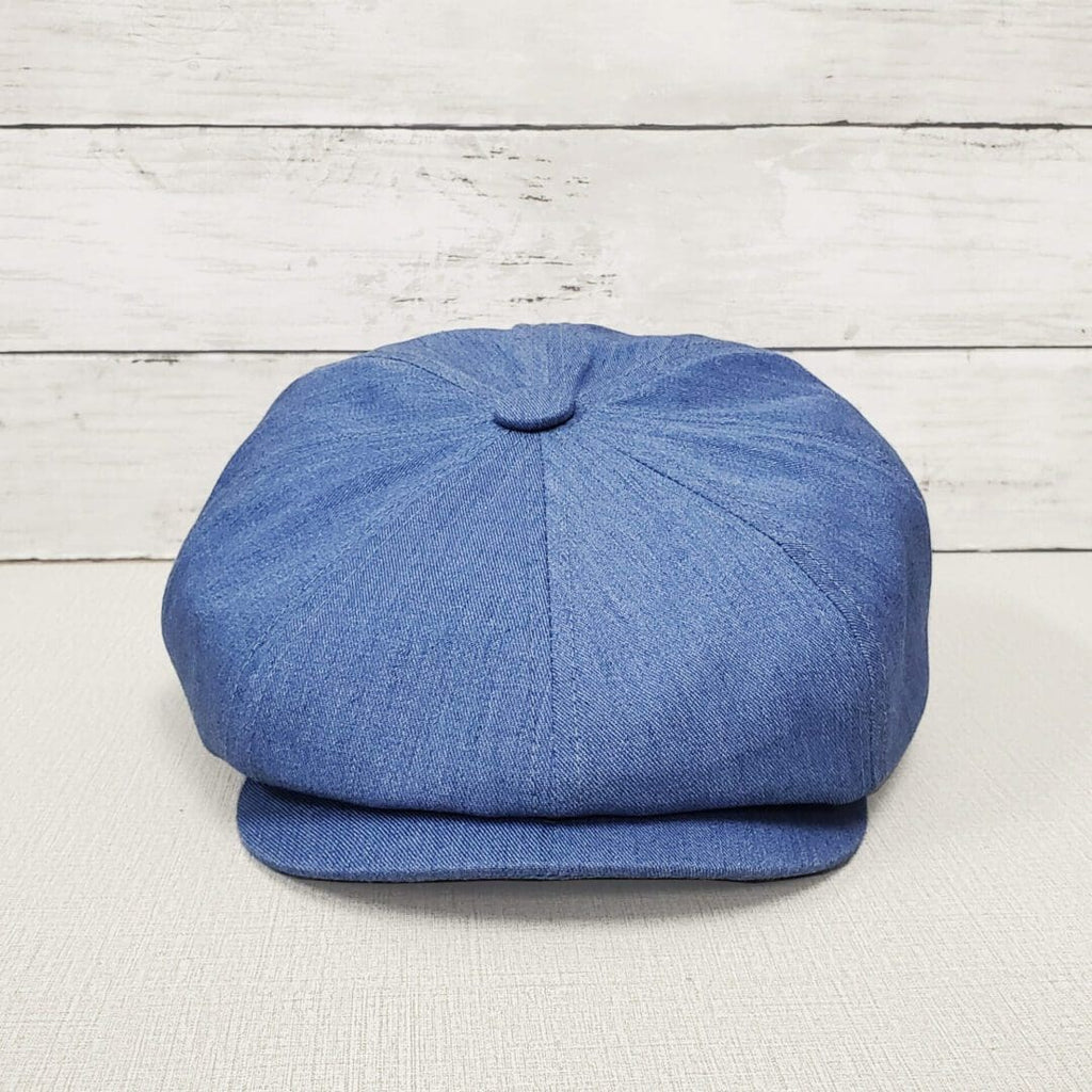 A blue hat is sitting on top of a table.