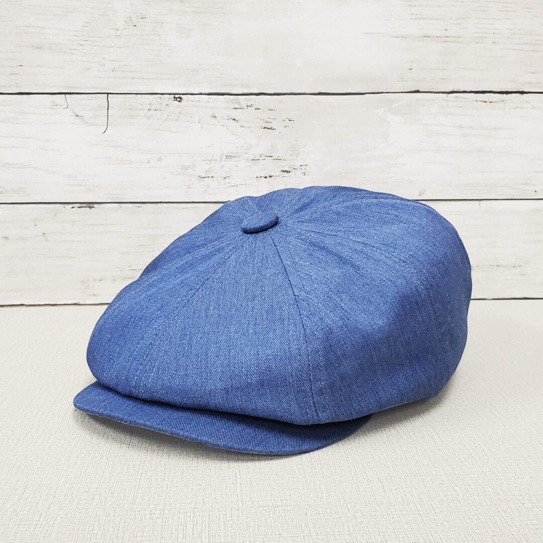 A blue hat is sitting on top of a table.