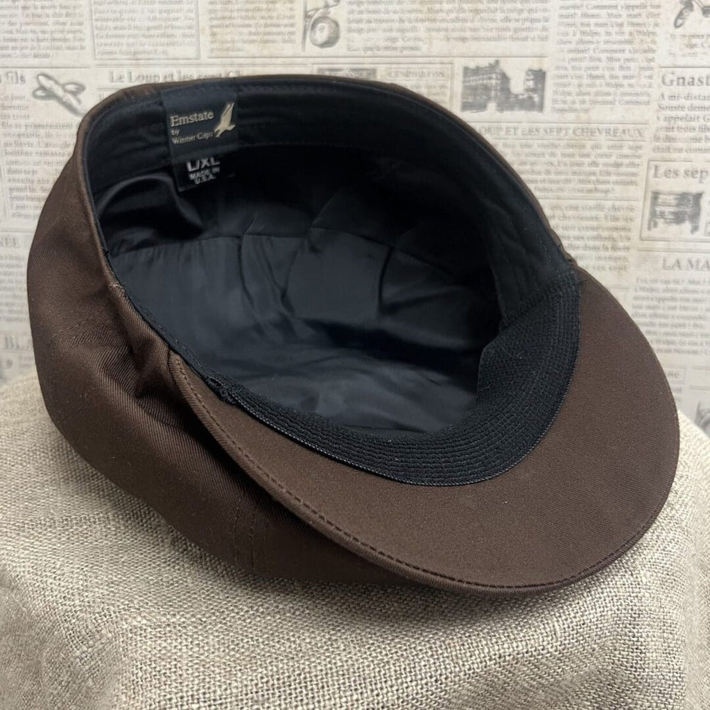 A brown hat is sitting on top of a table.