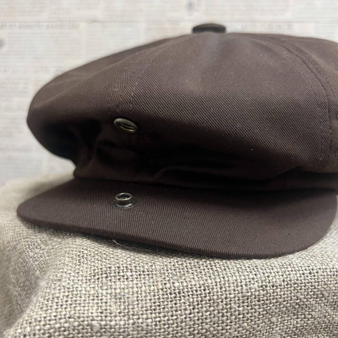 A brown hat sitting on top of a table.