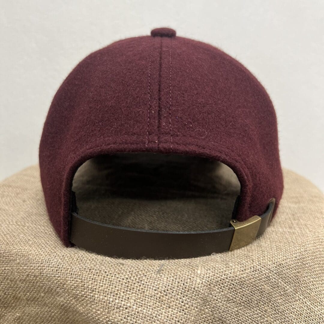 A hat that is on top of a brown sack.