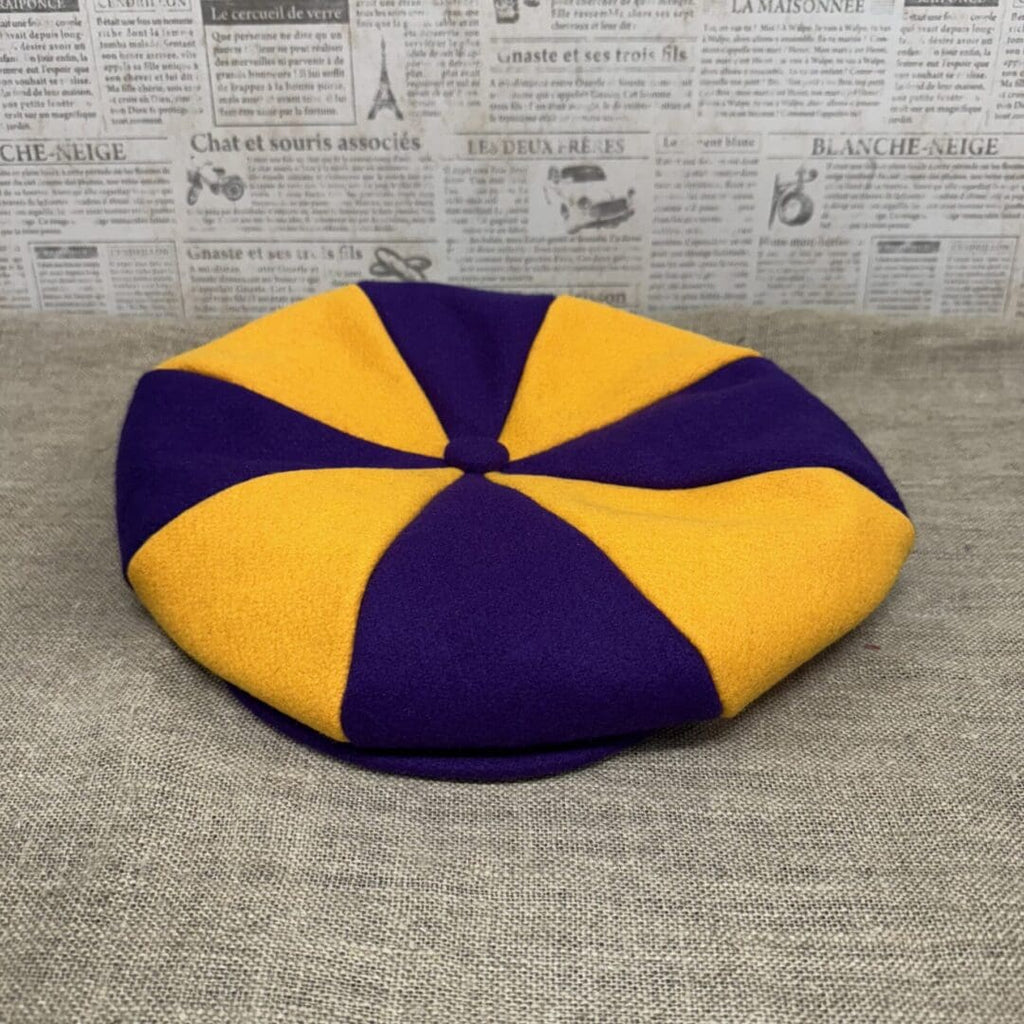 Purple and gold eight-panel newsboy cap.