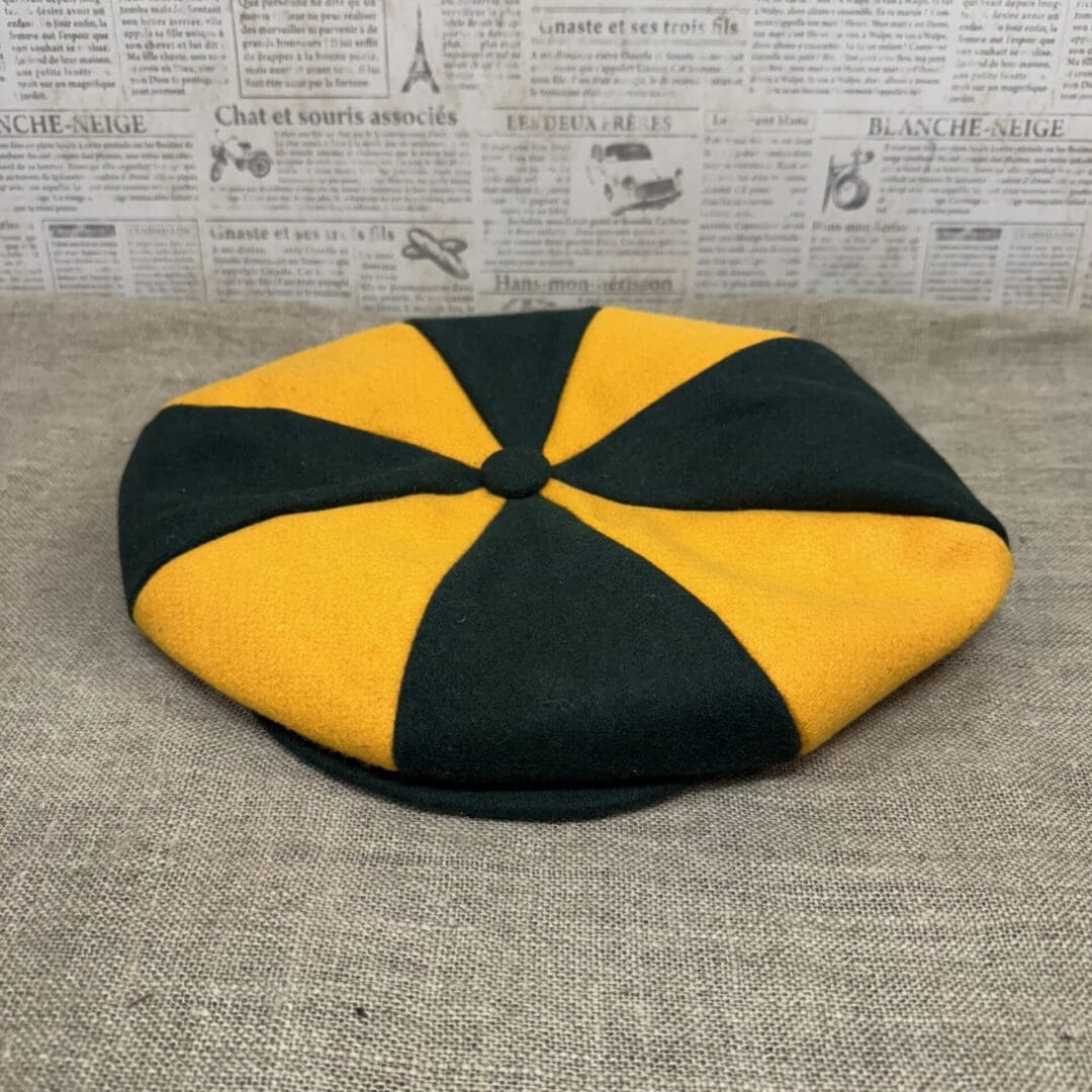 Gold and green eight-panel newsboy cap.