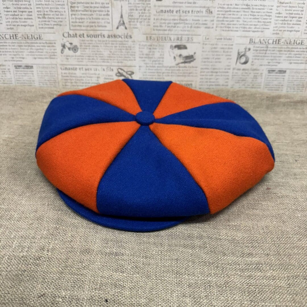 Blue and orange eight-panel newsboy cap.