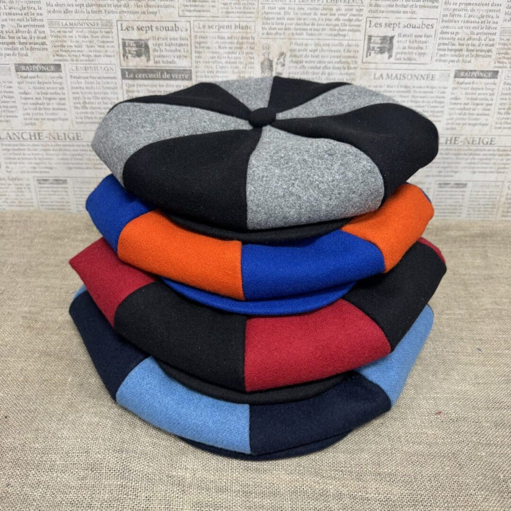 Stack of colorful wool berets.