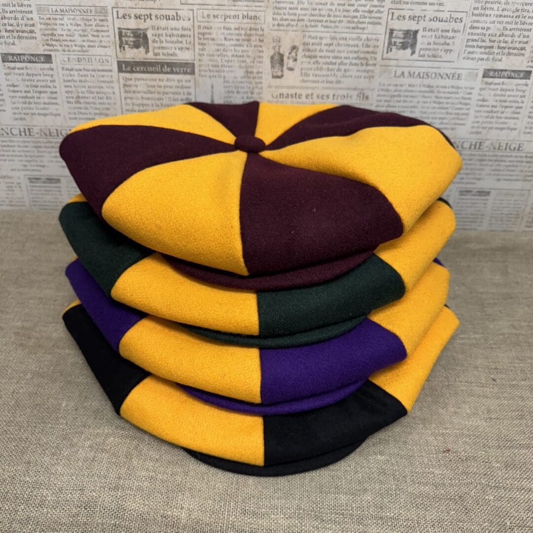 Stack of multicolored wool berets.