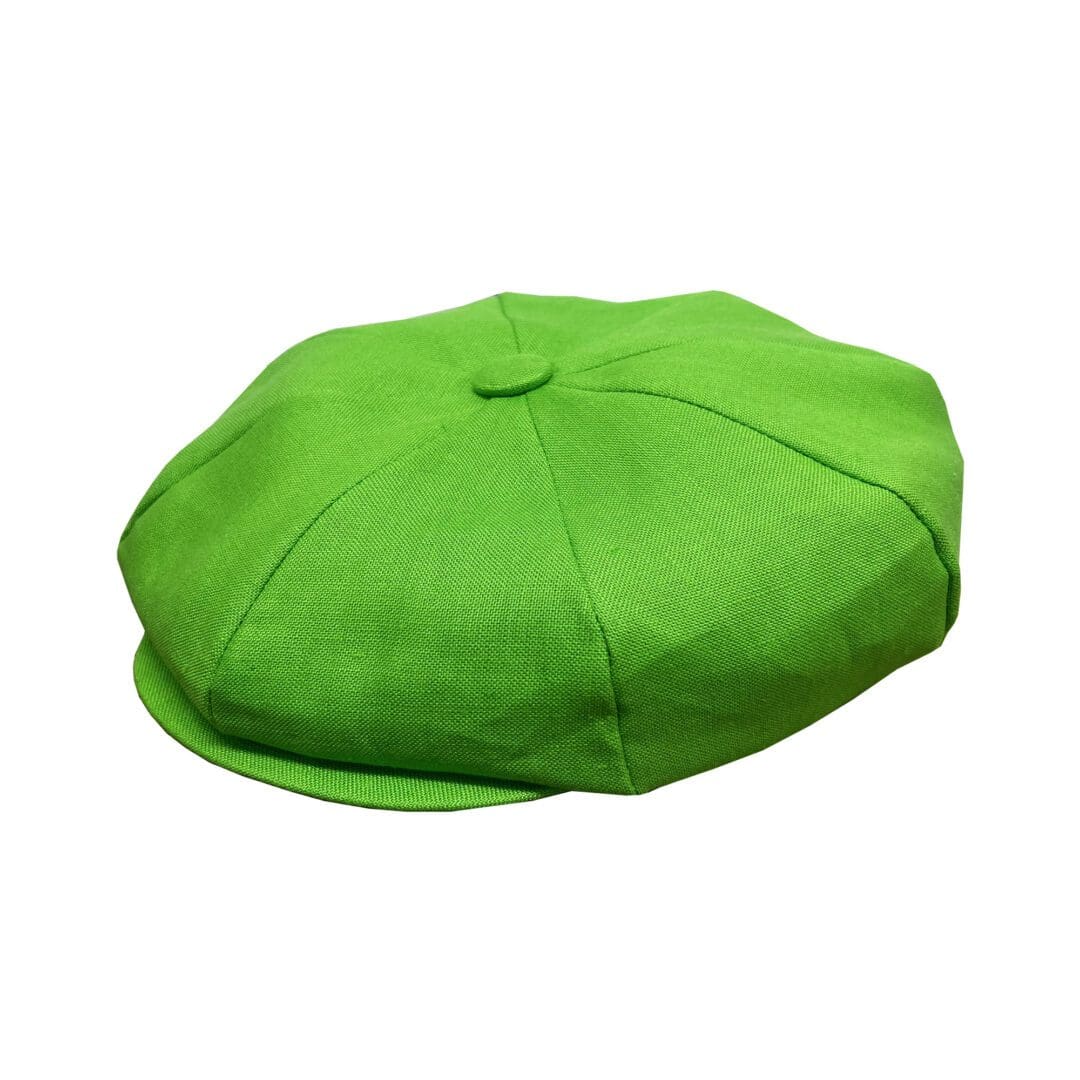 A green hat is sitting on the ground.
