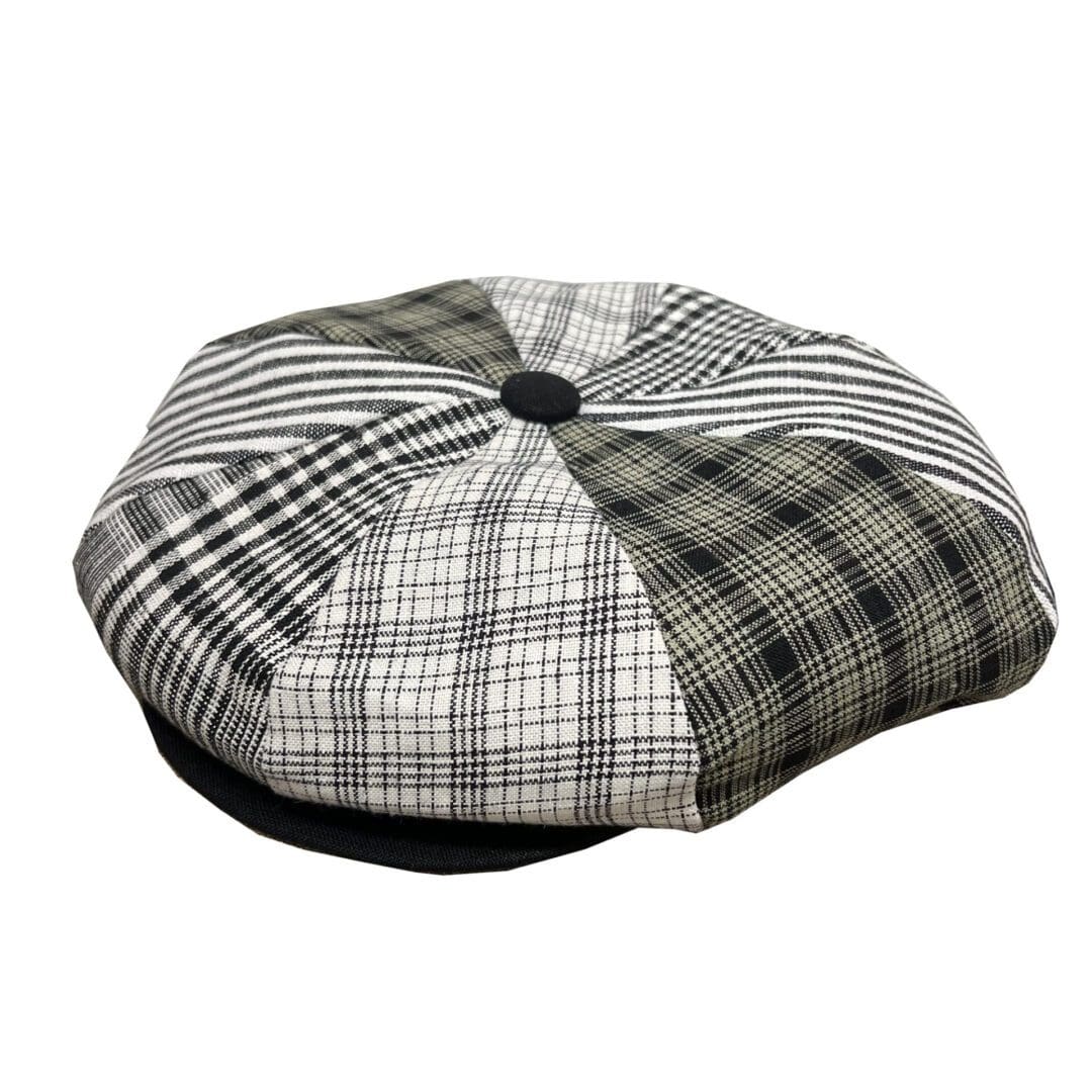 A black and white hat with plaid pattern.