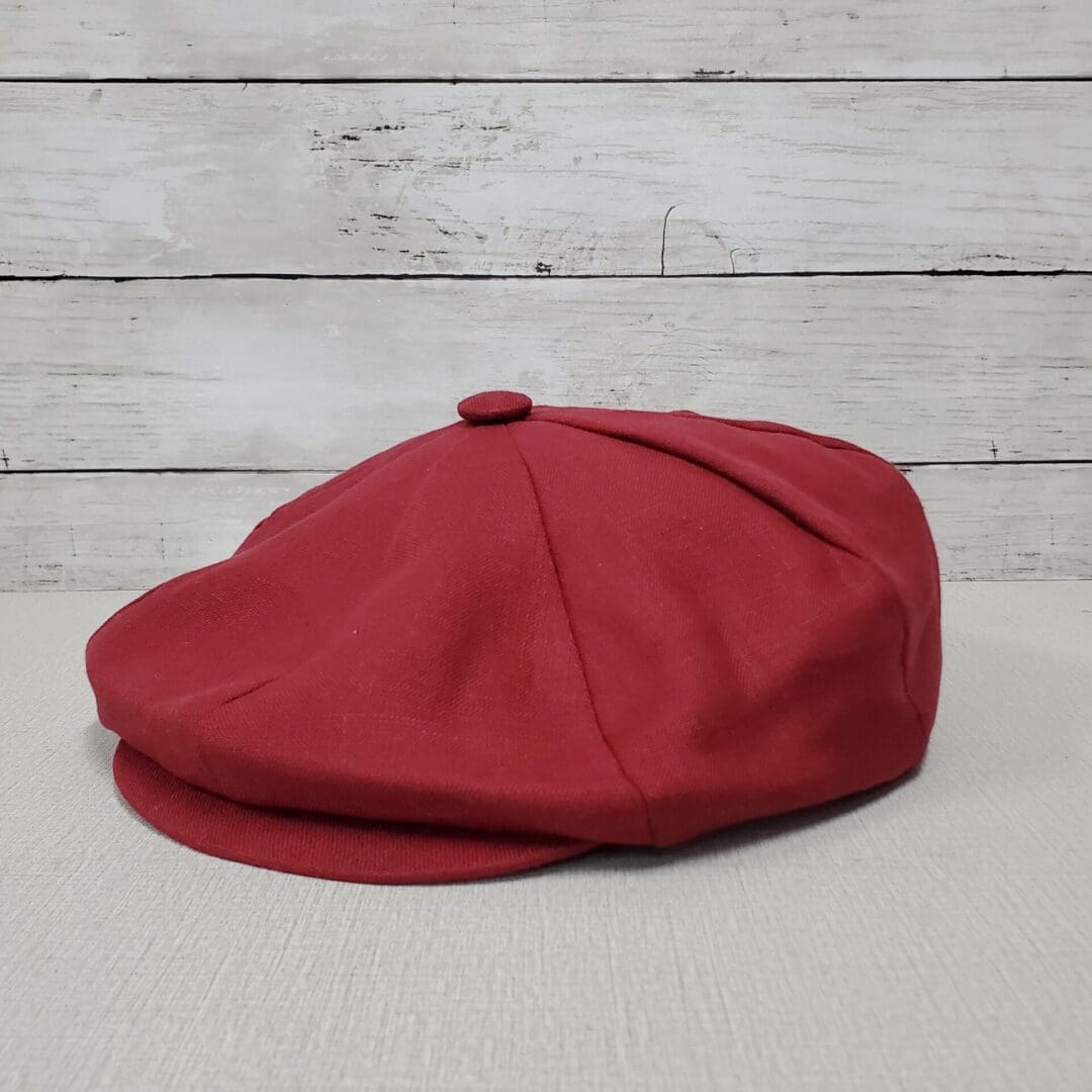 A red hat is sitting on the floor