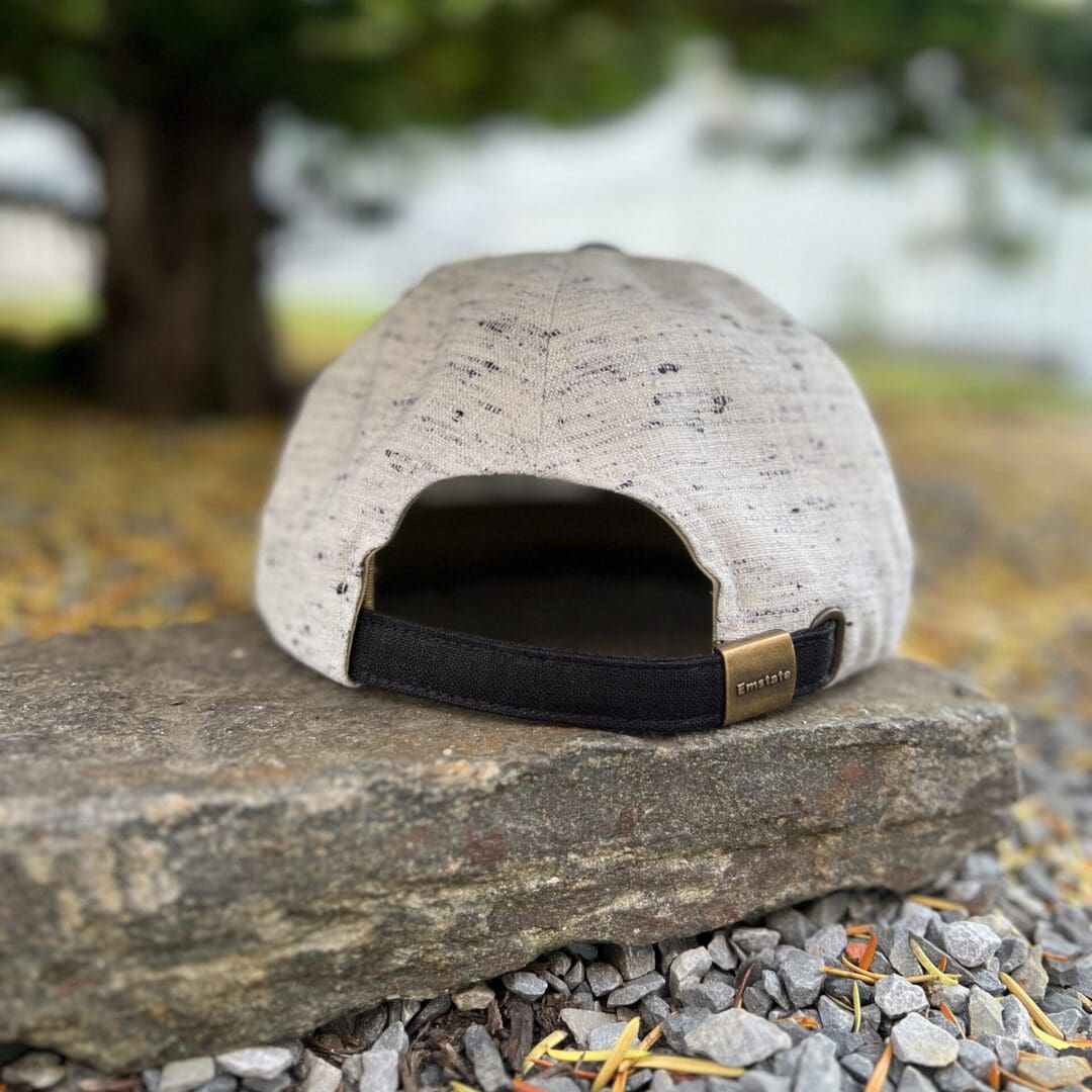 A stone bench with a hat on it