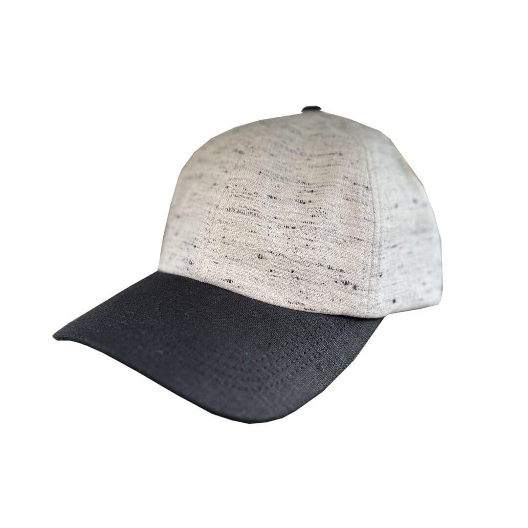 A baseball cap with a black and white pattern on it.