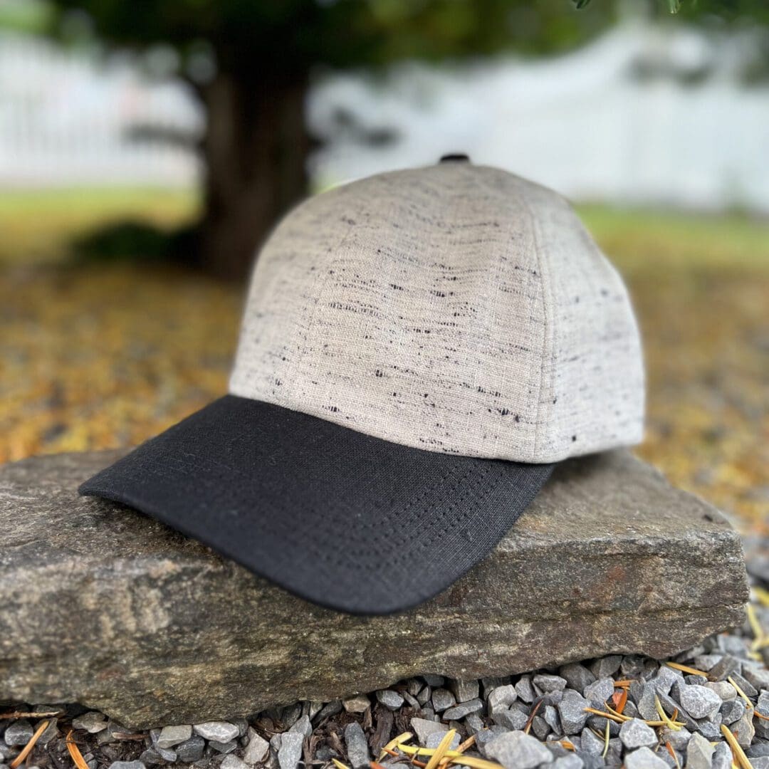 A hat sitting on top of a rock.