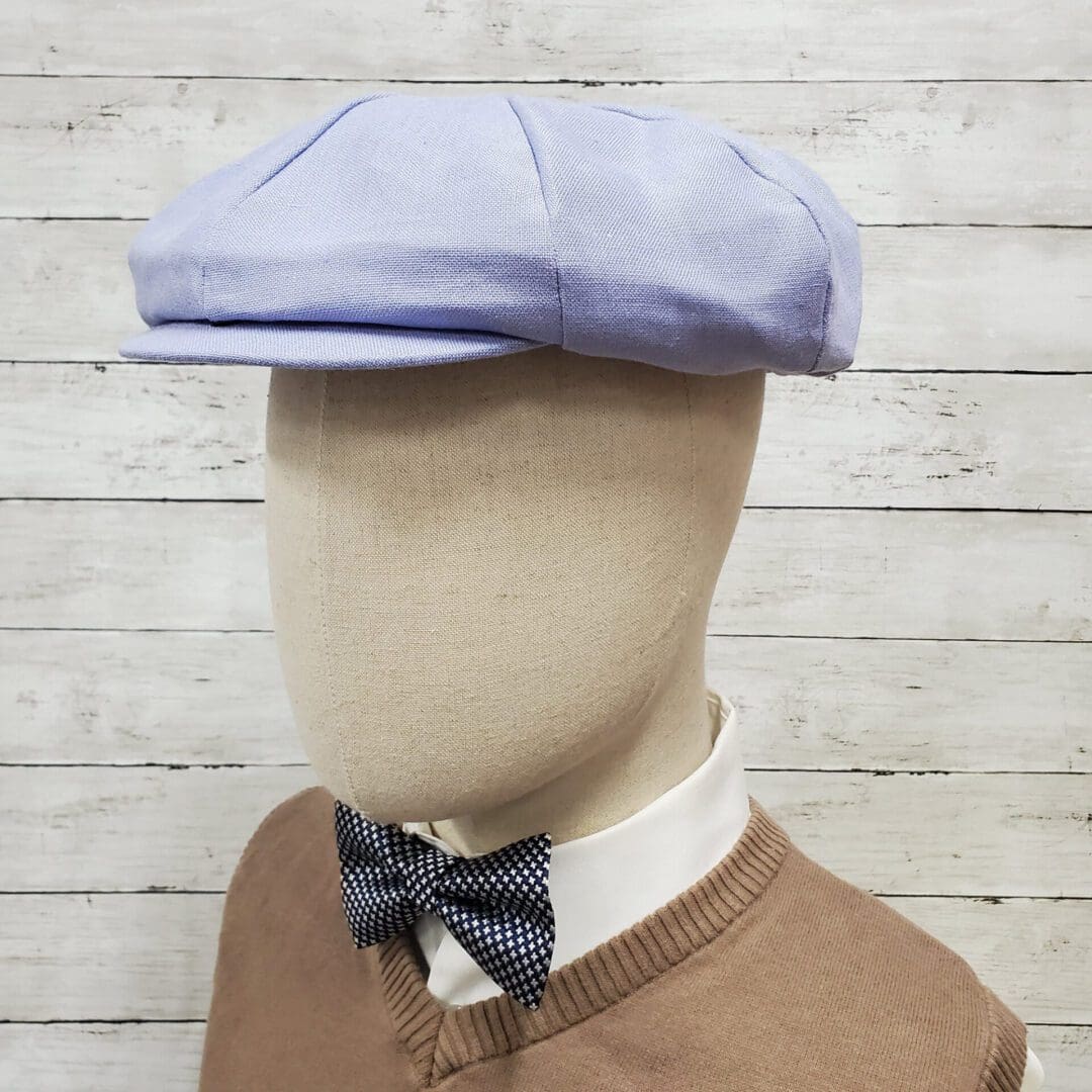 A man wearing a bow tie and hat