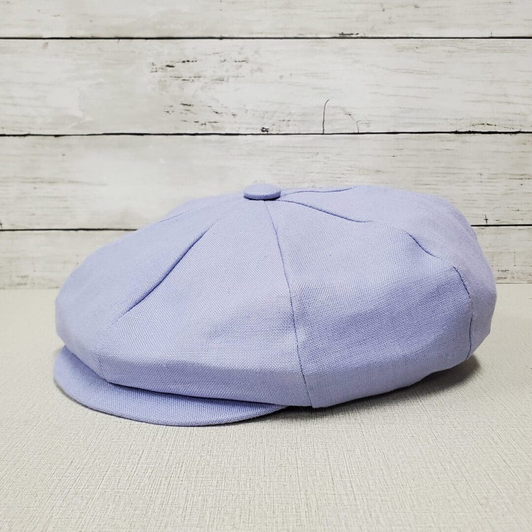 A light blue hat is sitting on the floor.