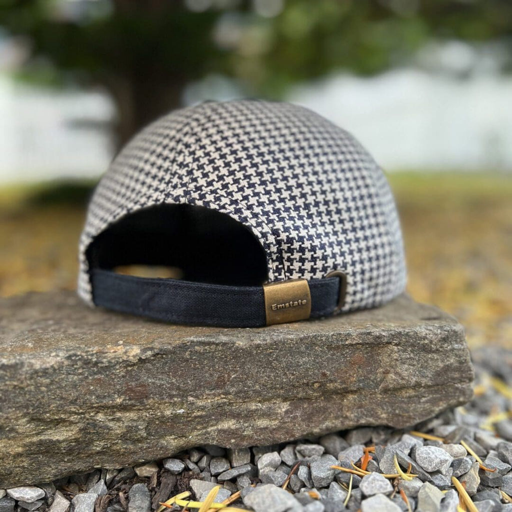 A hat sitting on top of a rock.