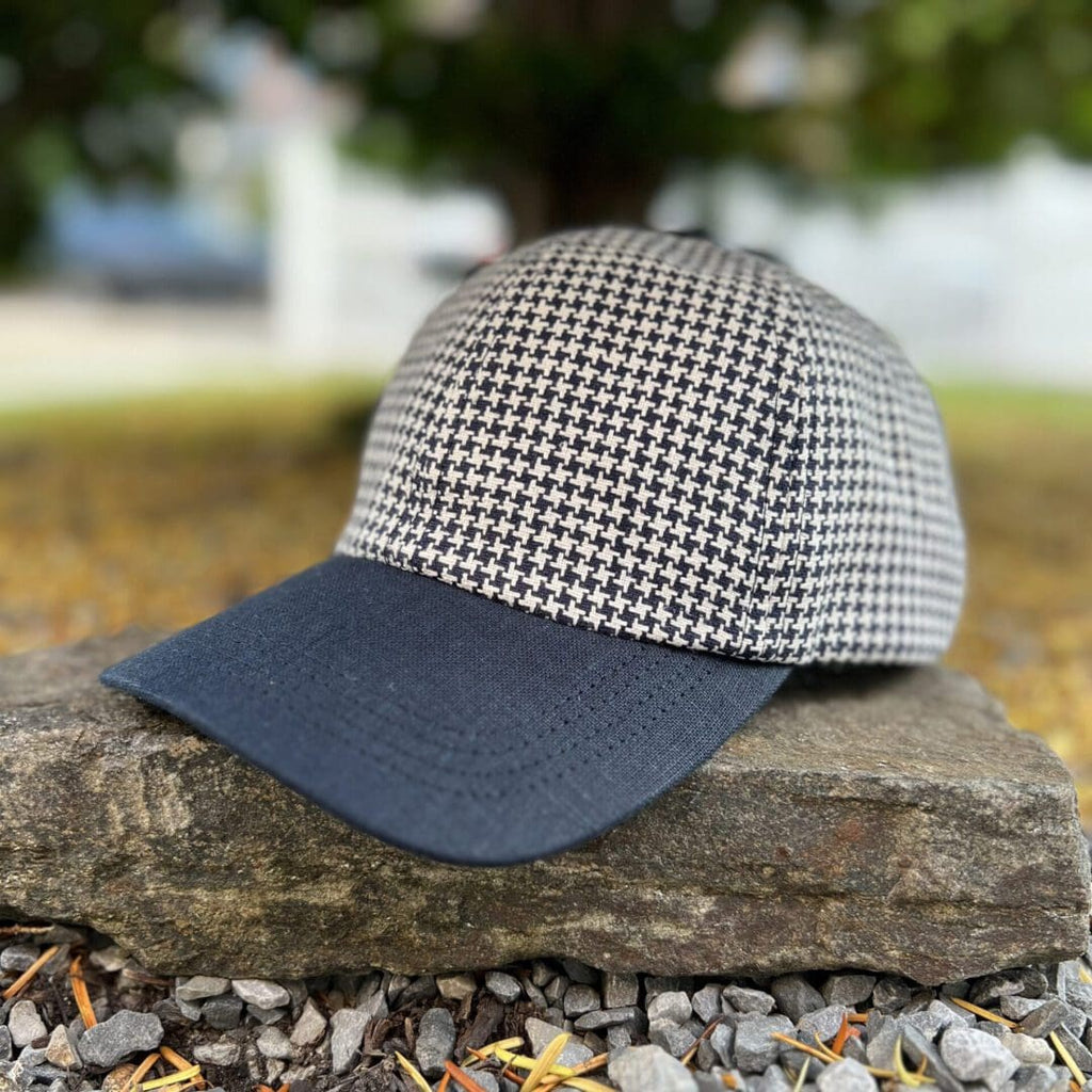 A hat is sitting on the ground outside.