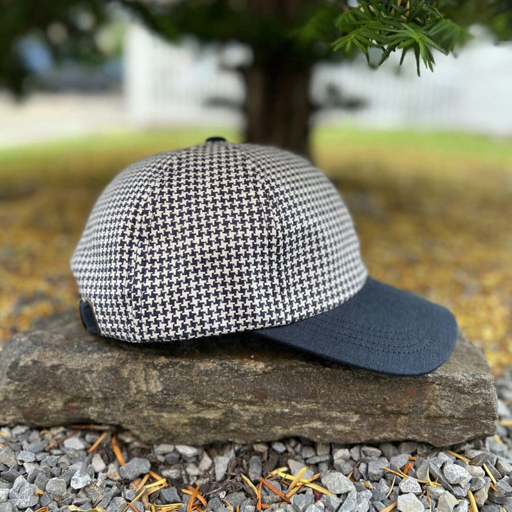 A hat sitting on top of a rock.