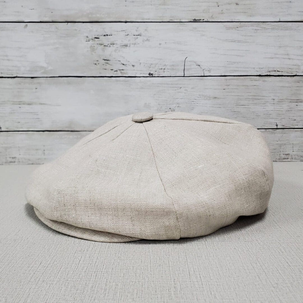 A white hat sitting on top of a table.