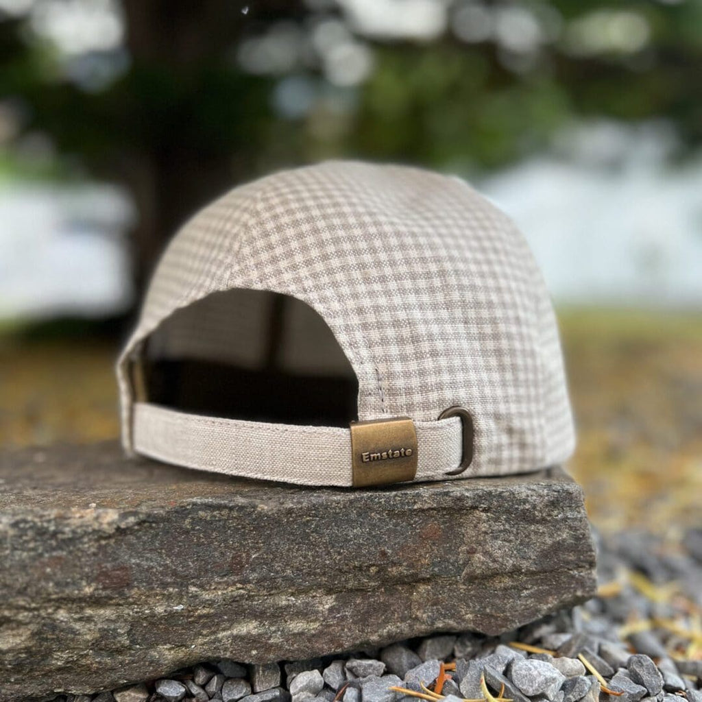 A hat sitting on top of a rock.