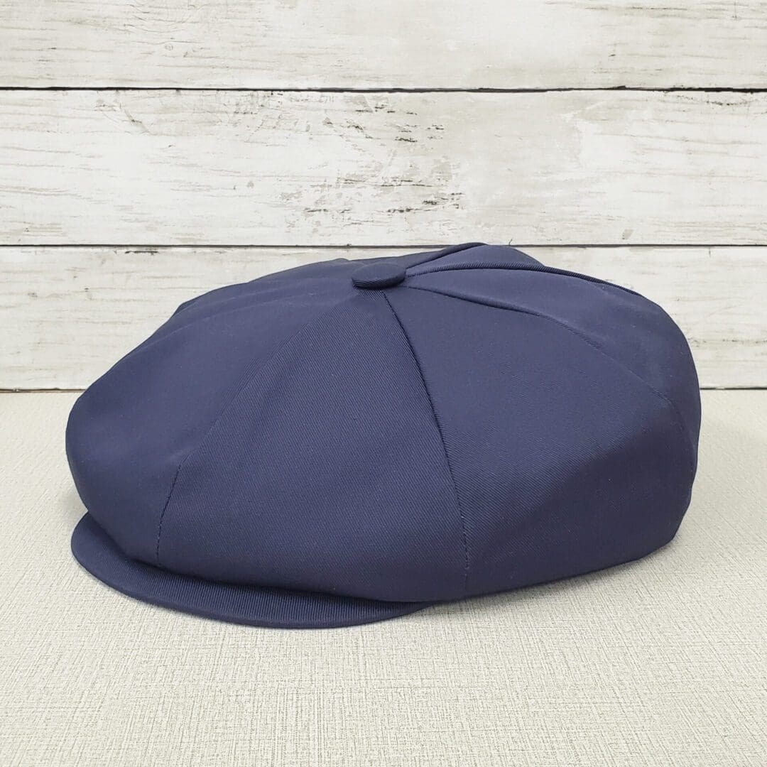 A blue hat is sitting on the floor