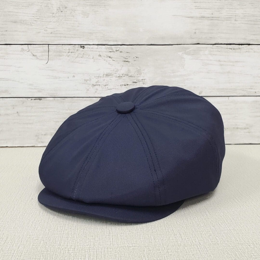A blue hat is sitting on the ground