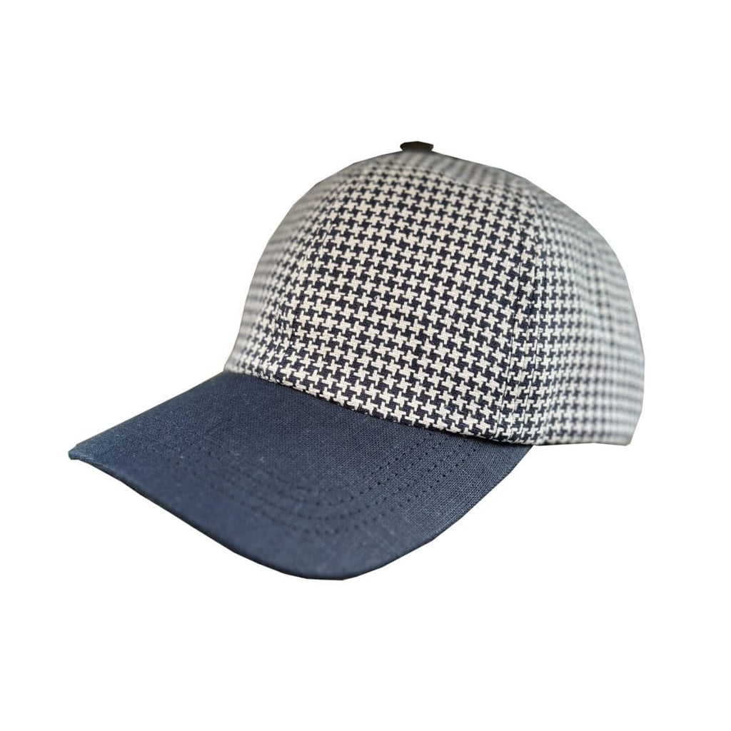 A baseball cap with a black and white pattern on it.