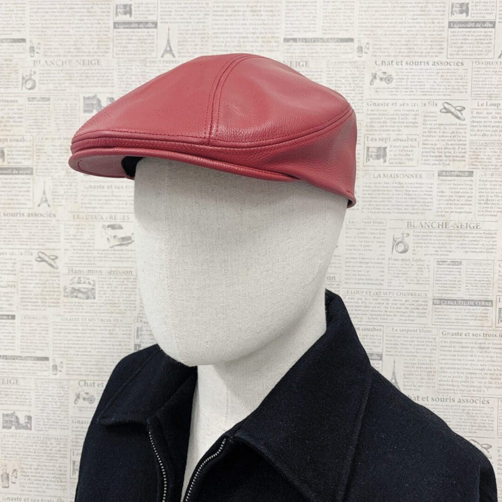 A man wearing a red hat and black jacket.