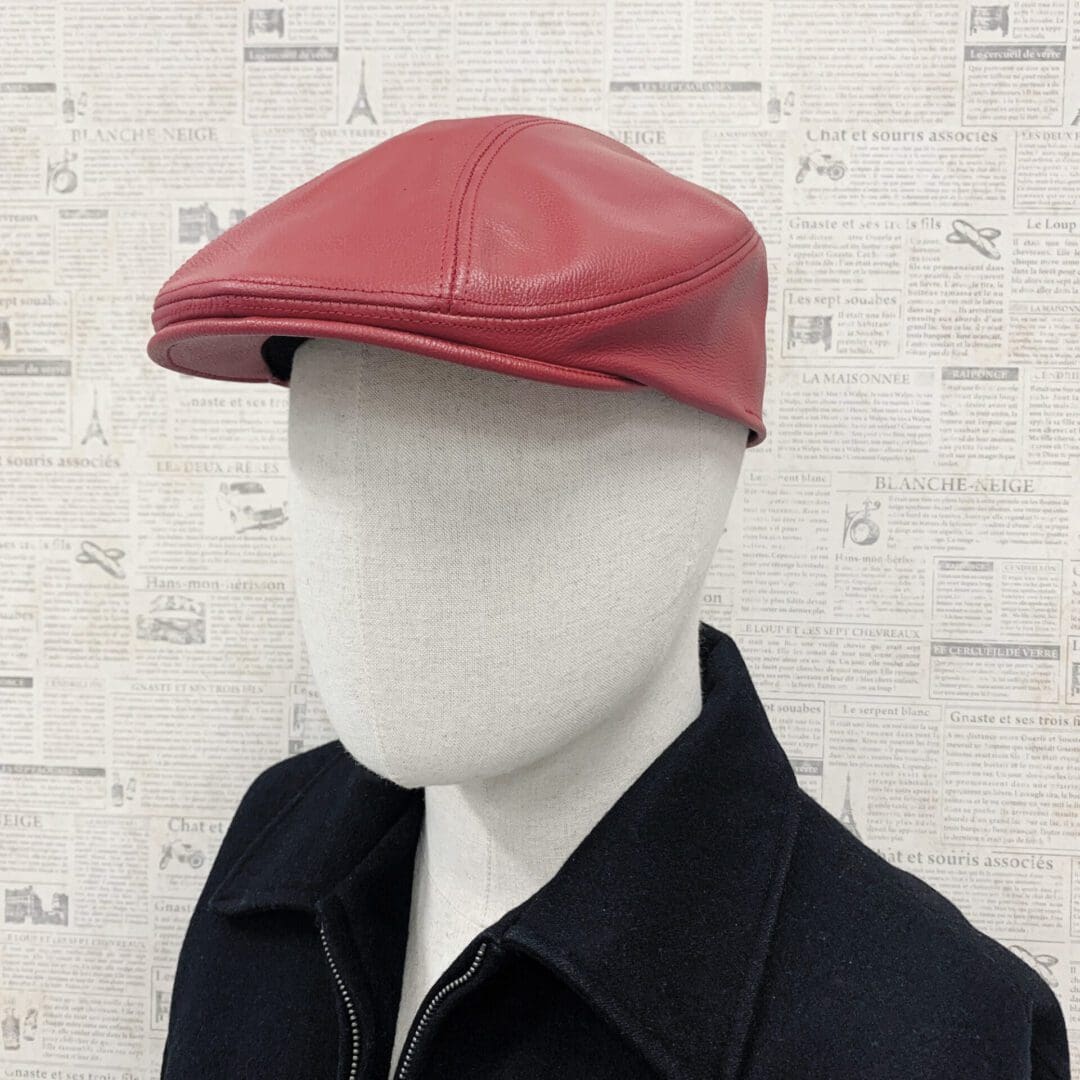 A man wearing a red hat and black jacket.