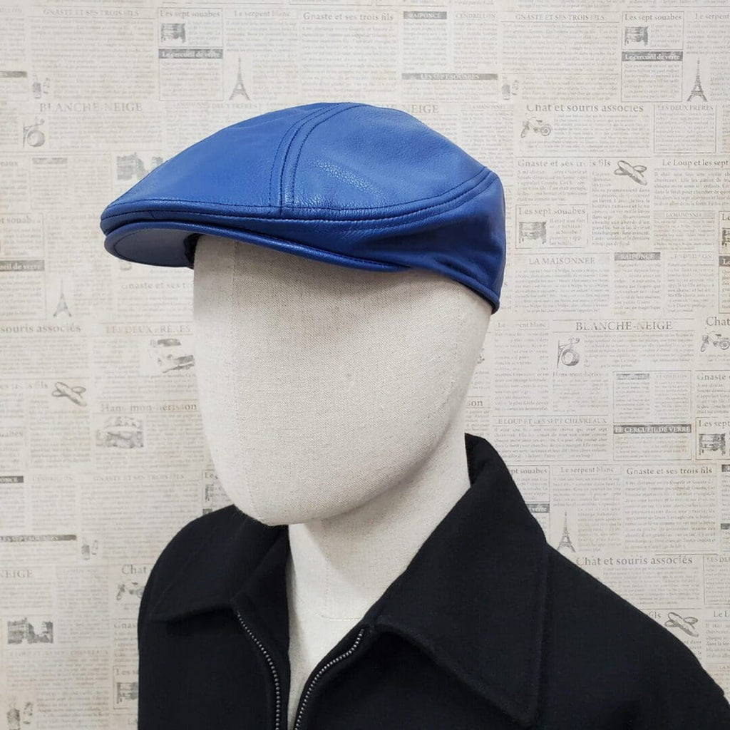 A man wearing a blue hat and black jacket.