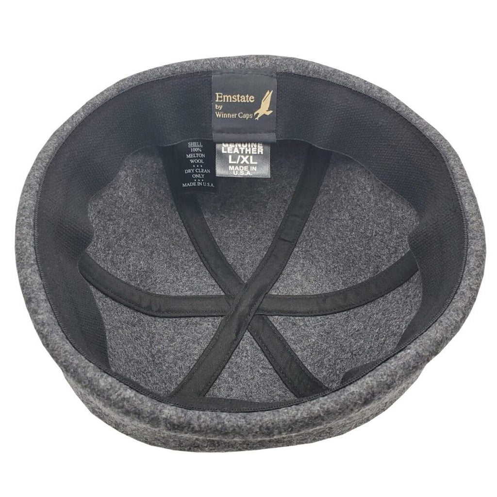 A gray hat with black trim and a label.