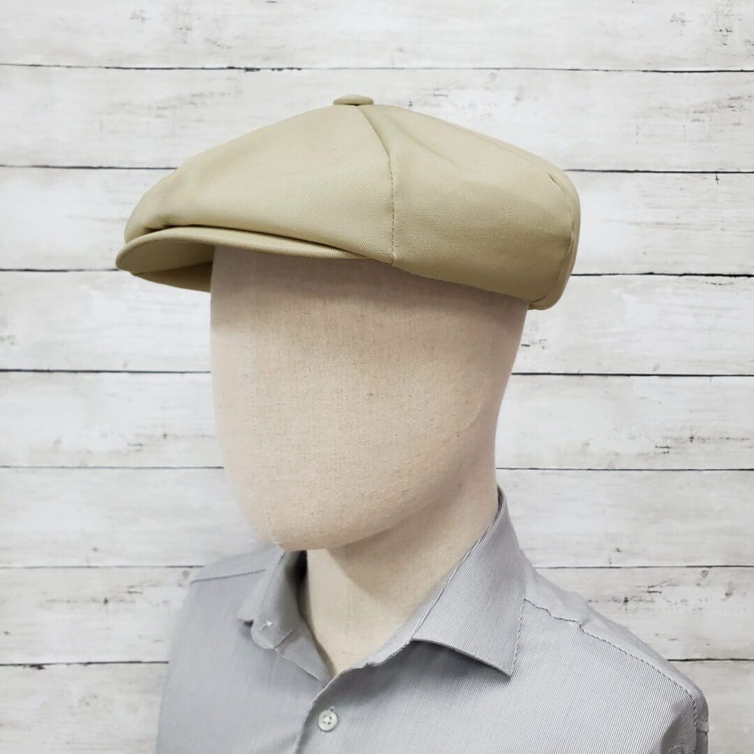 A man wearing a hat with no face.