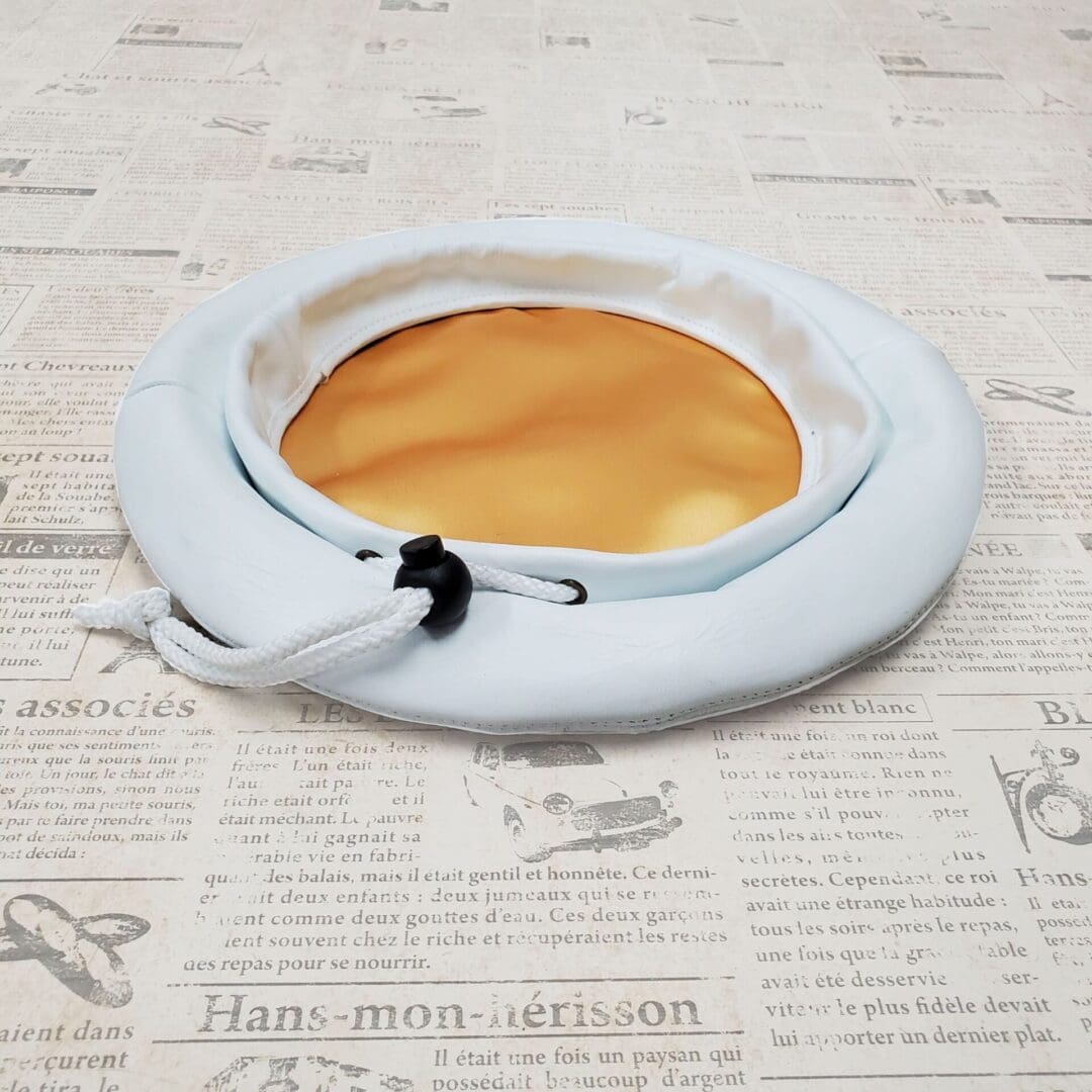 A white plate with a cup of coffee on top