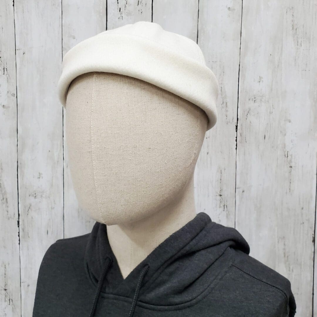 A person wearing a hat and hoodie