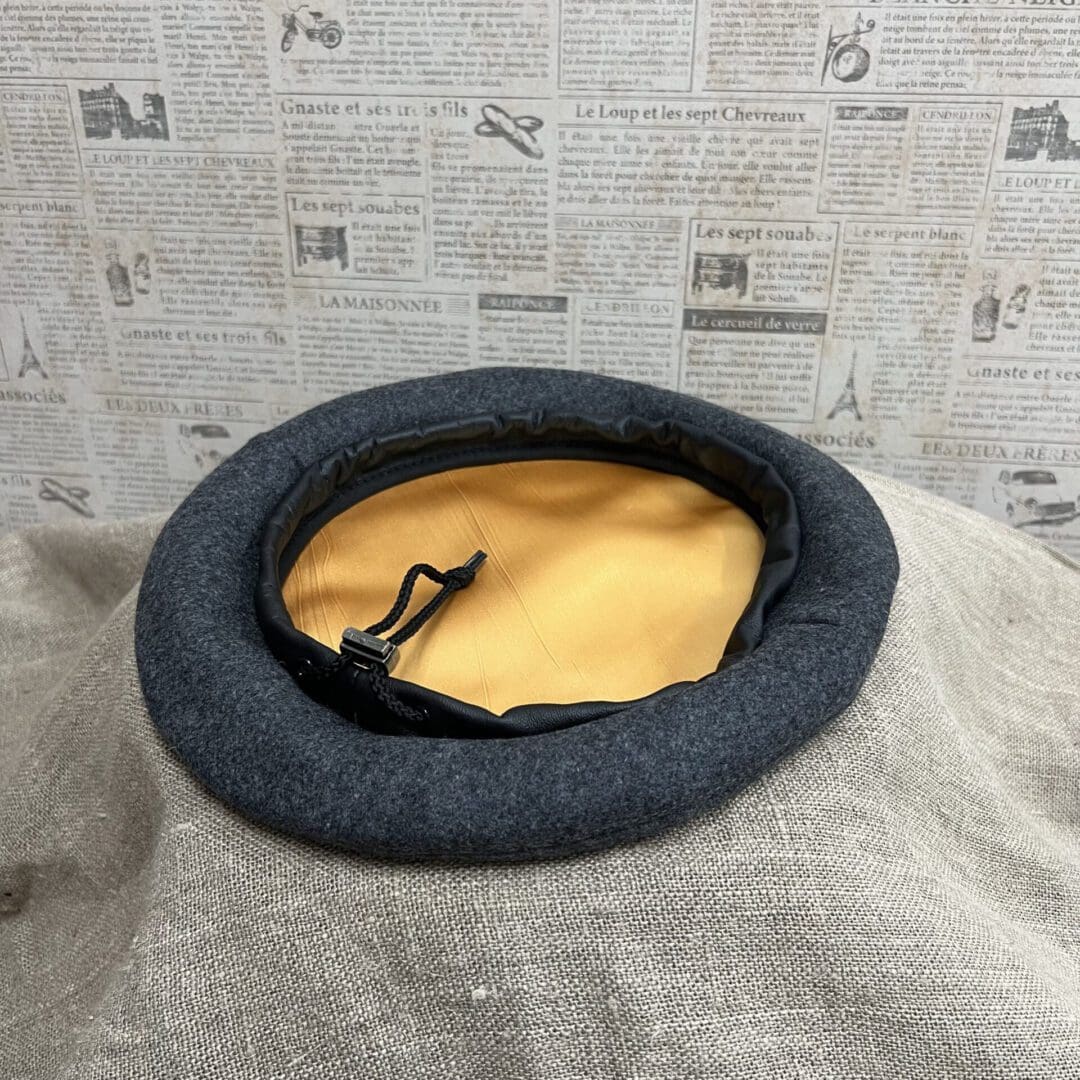 A dog bed with a yellow pillow inside of it