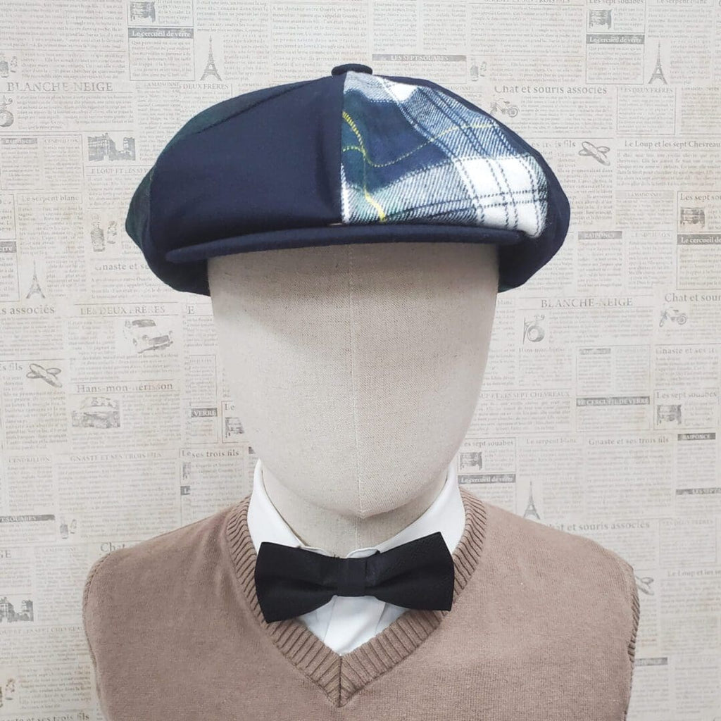 A mannequin wearing a bow tie and a hat.