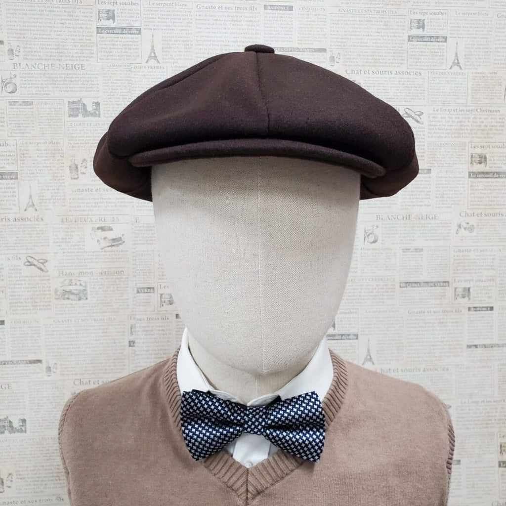 A man wearing a bow tie and hat