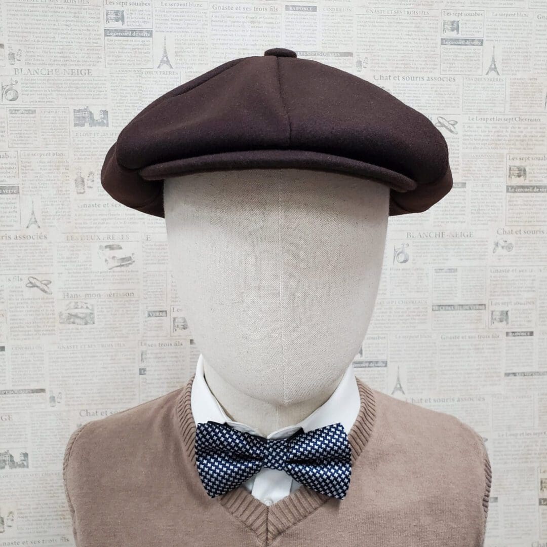 A man wearing a bow tie and hat