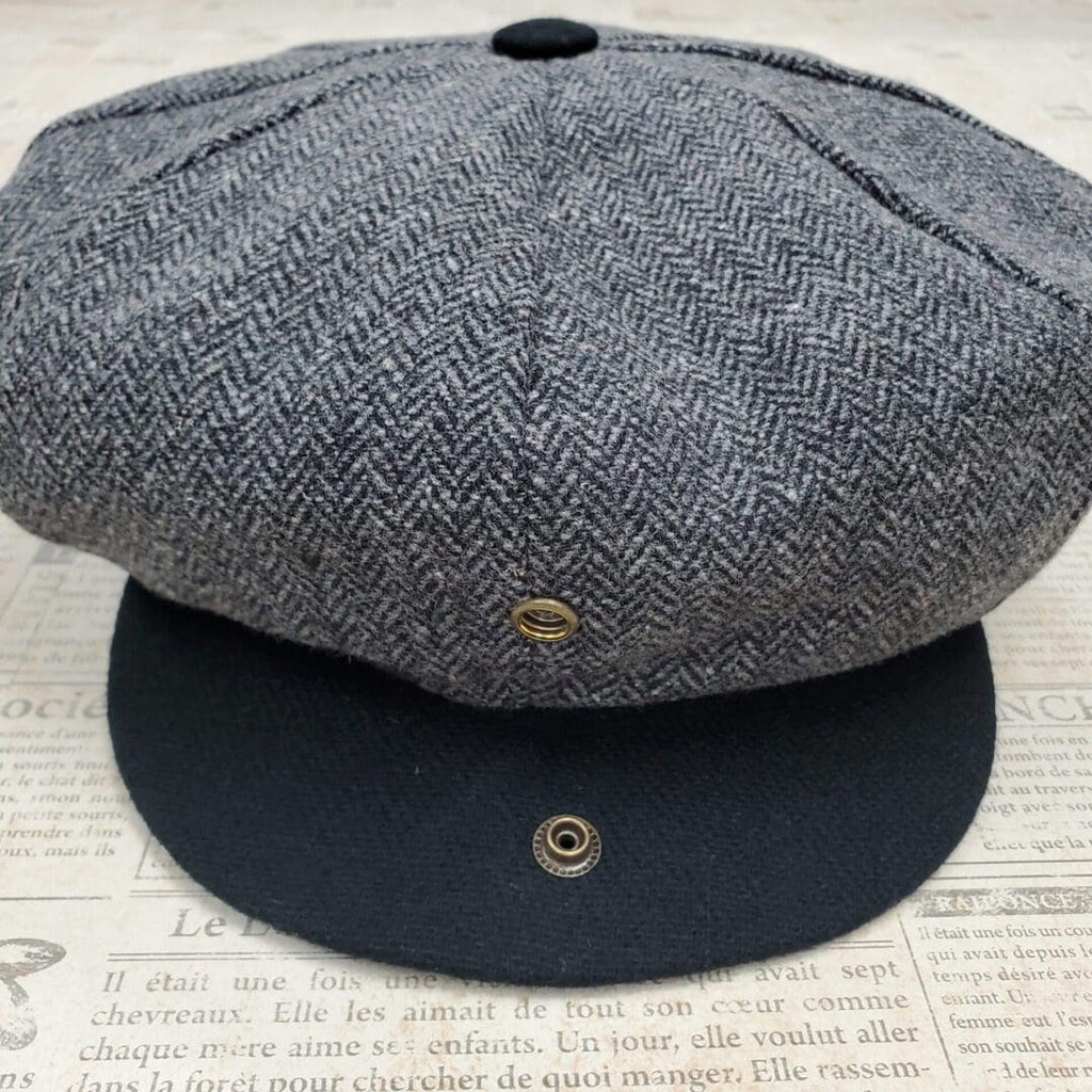 A hat is shown on top of the newspaper.