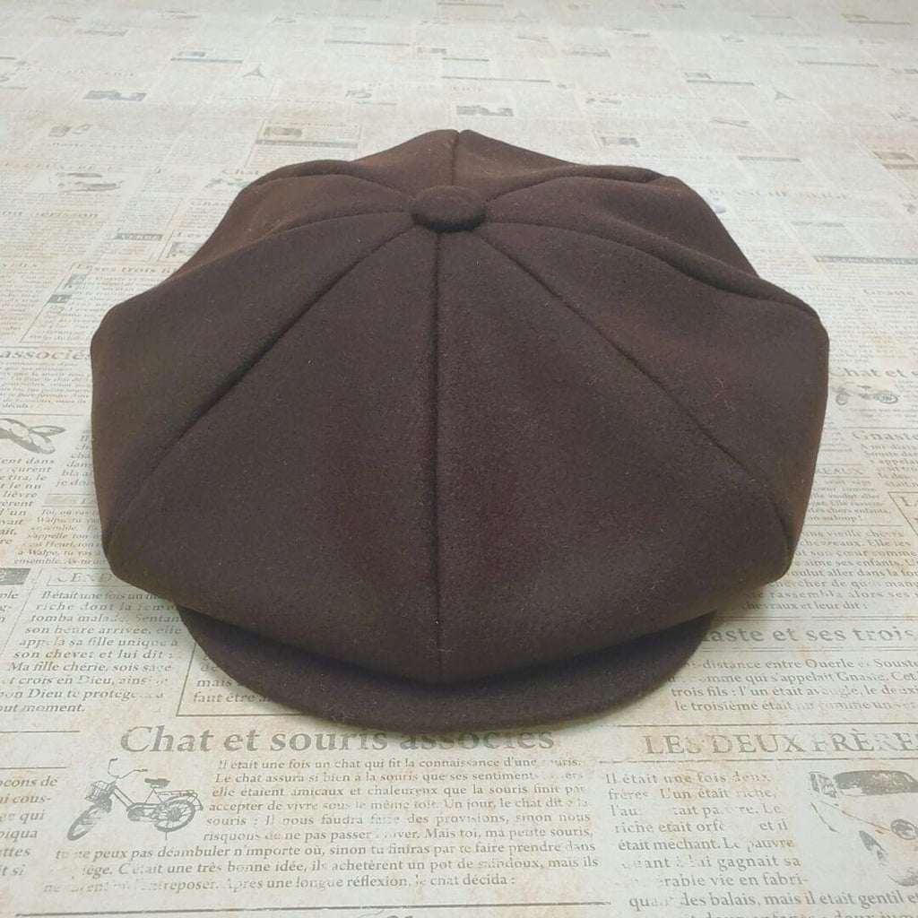 A brown hat sitting on top of a floor.